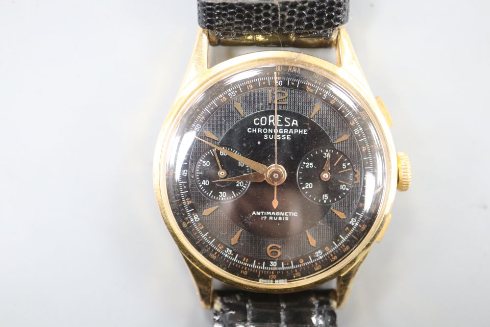 A gentlemans 1960s? 18k Coresa chronograph manual wind wrist watch, on later strap.